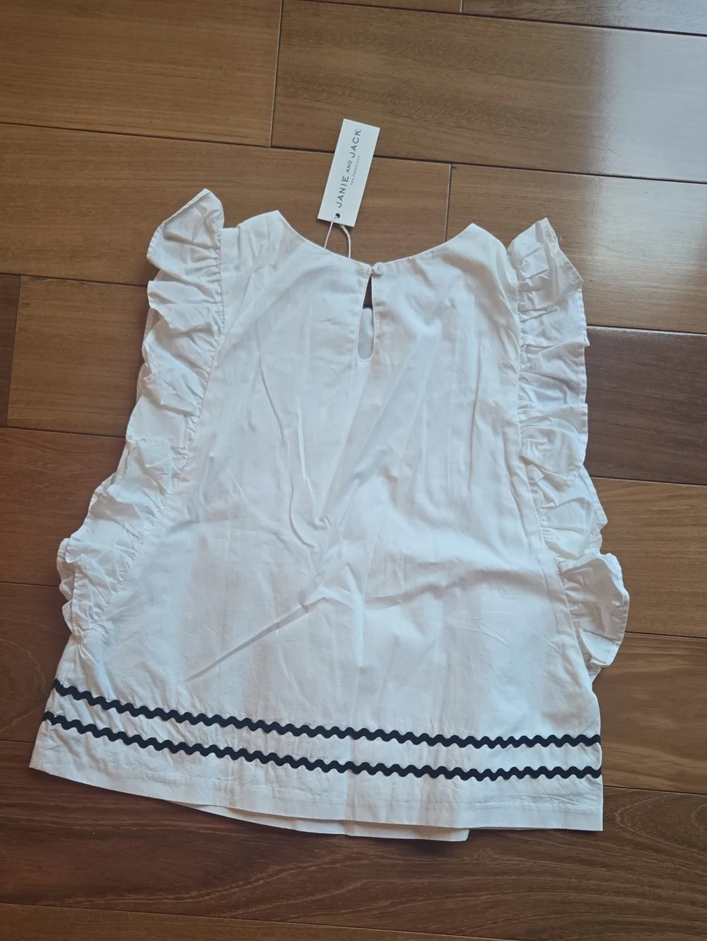 Janue And Jack Girls White Ruffle Trim Sleeveless Top with Navy Accent